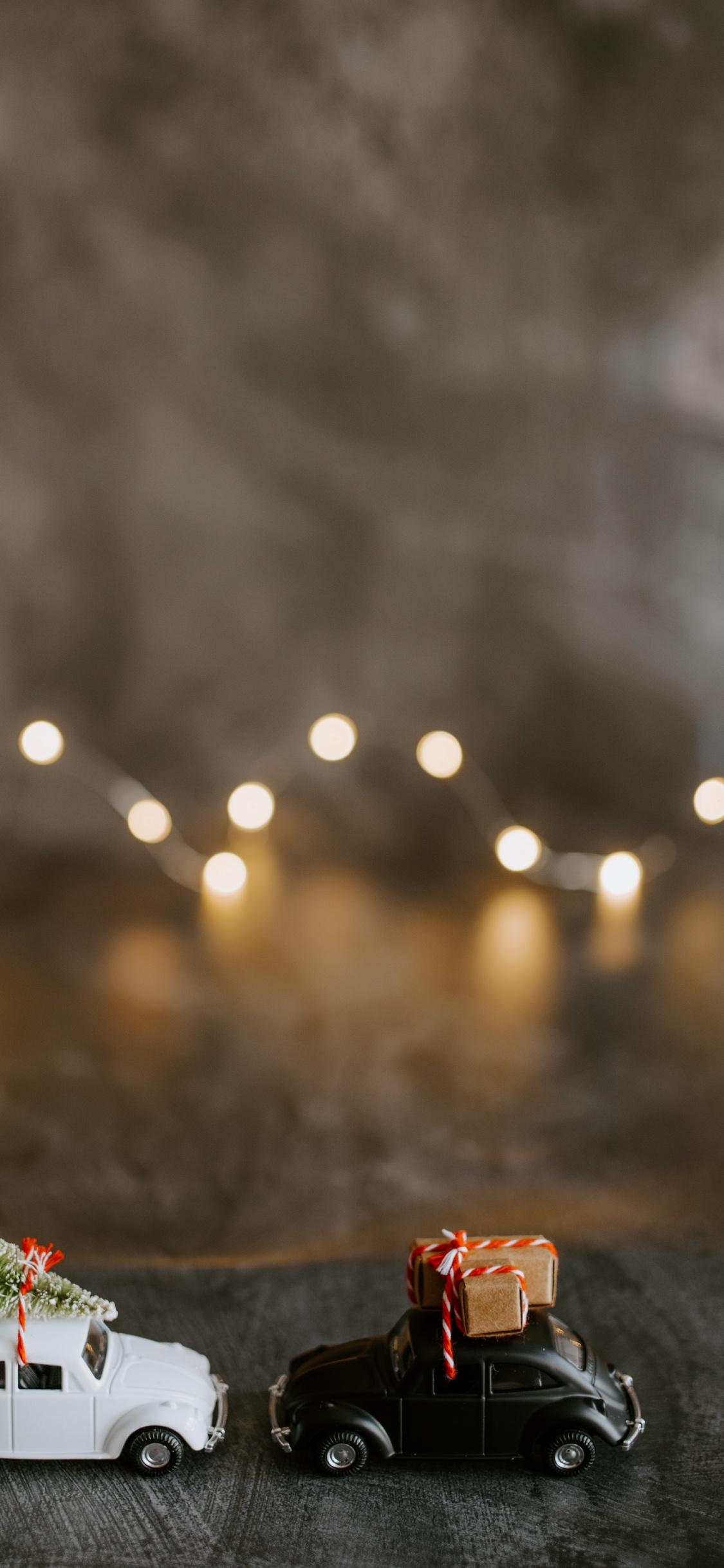 Red and White Gift Box on Brown Wooden Table. Wallpaper in 1125x2436 Resolution