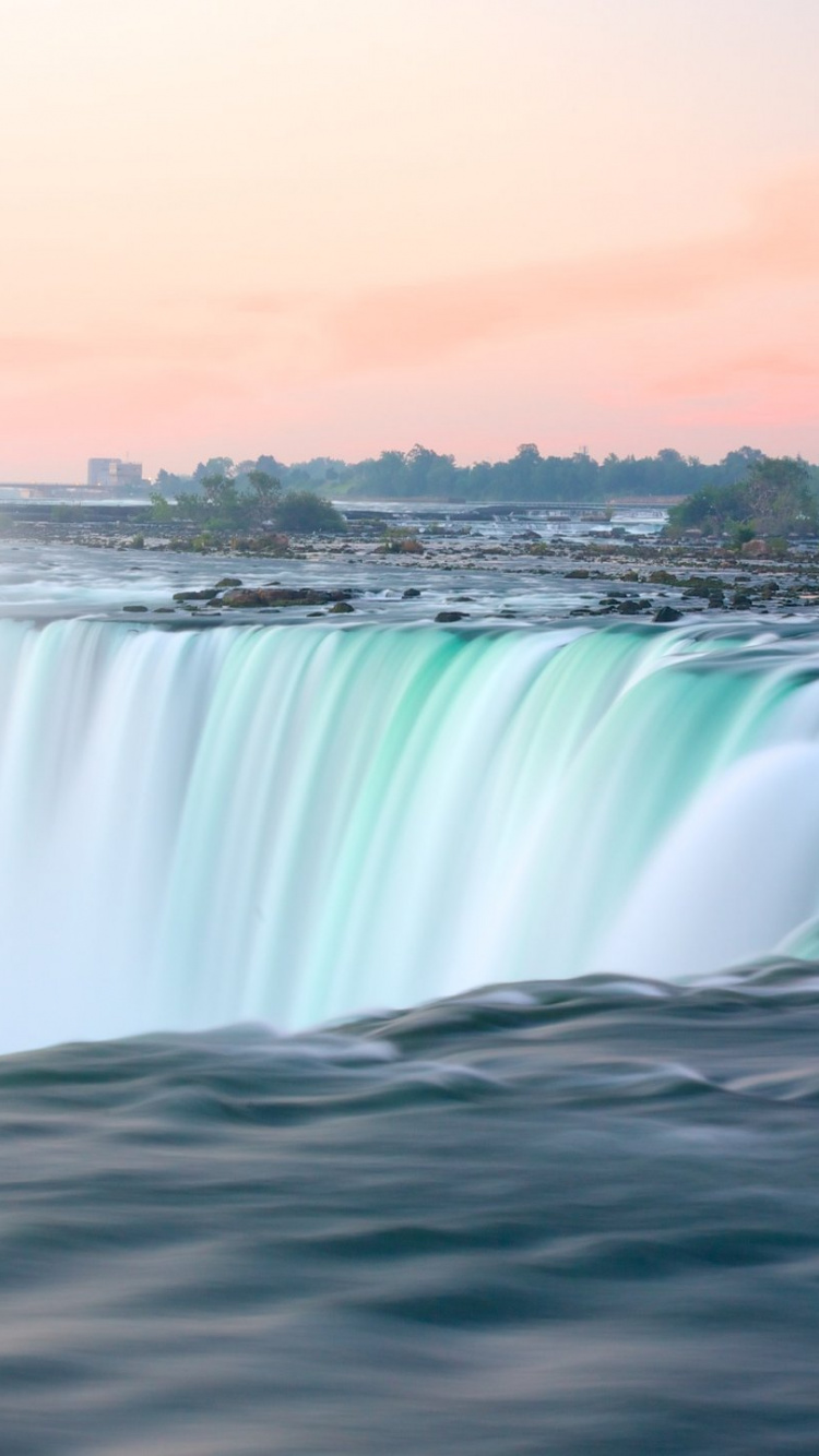 Water Falls Under Blue Sky During Daytime. Wallpaper in 750x1334 Resolution