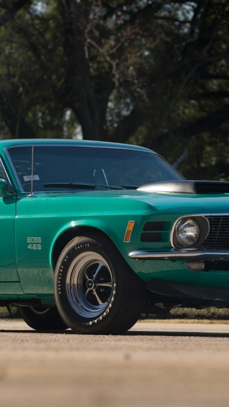 Green Chevrolet Camaro on Road During Daytime. Wallpaper in 750x1334 Resolution
