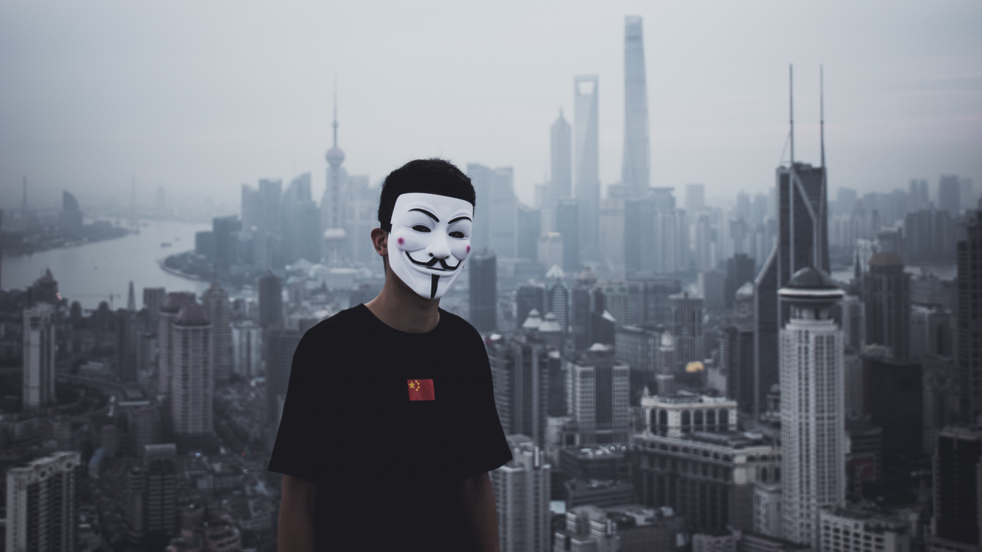 Man in Black Crew Neck T-shirt Standing on Top of Building During Daytime. Wallpaper in 1920x1080 Resolution