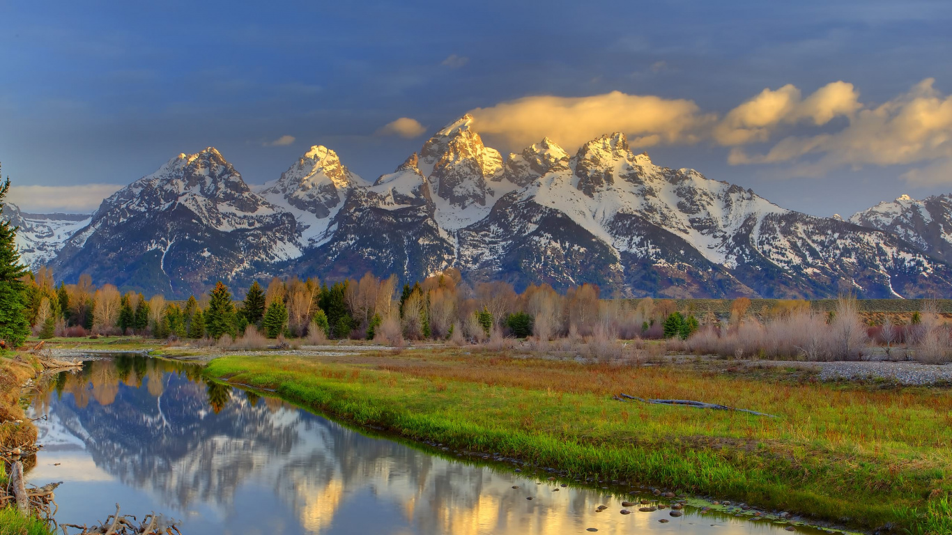 Green Grass Field Near Lake and Snow Covered Mountain During Daytime. Wallpaper in 1366x768 Resolution