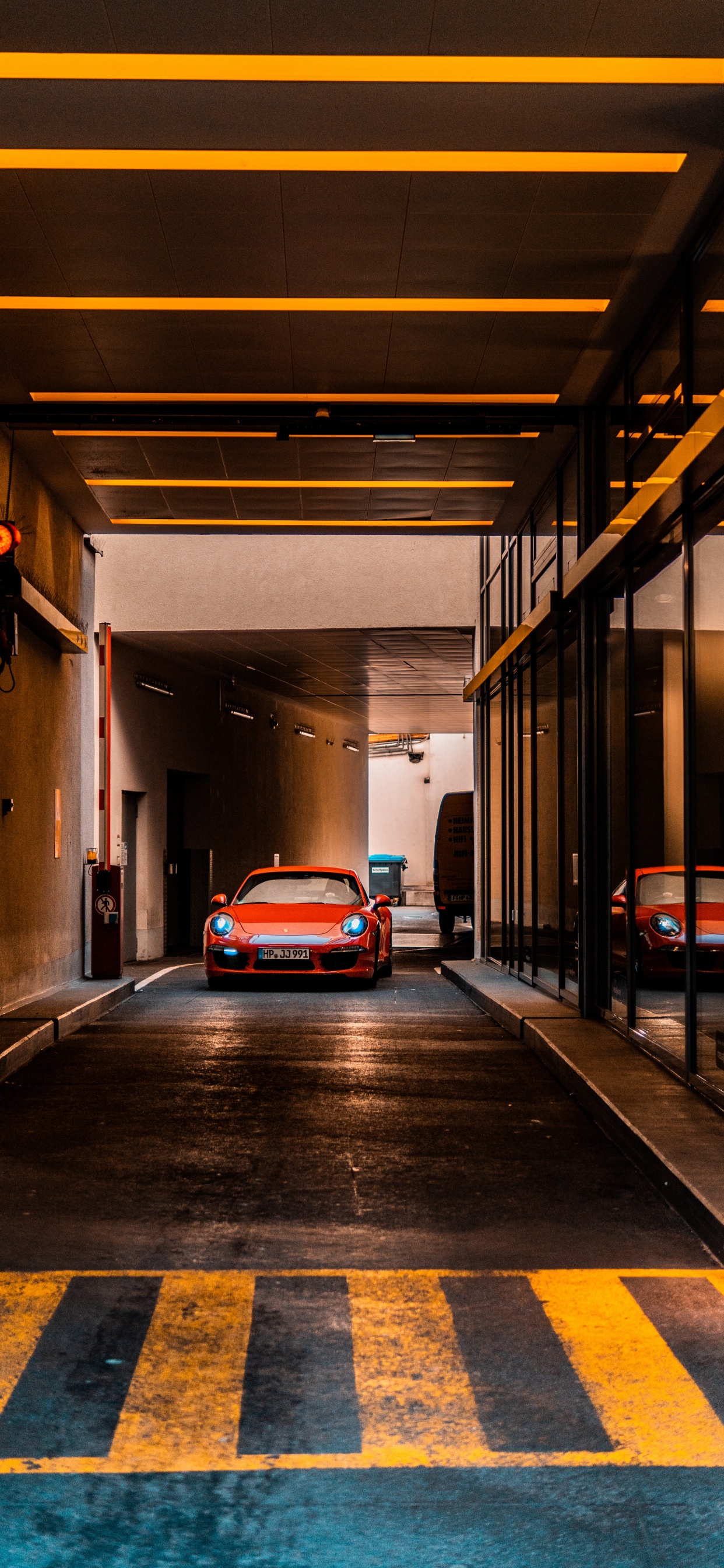 Red Car Parked on Tunnel. Wallpaper in 1242x2688 Resolution