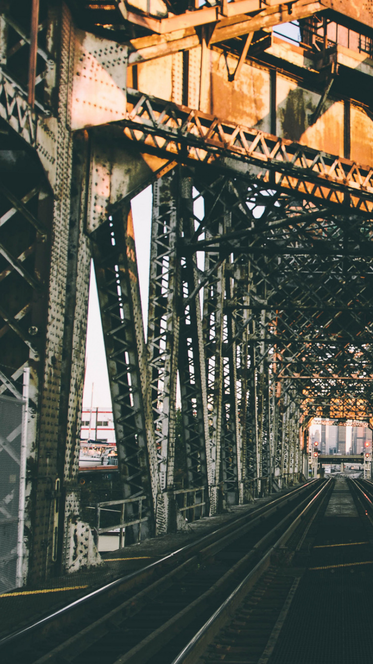 Black Metal Train Rail During Daytime. Wallpaper in 750x1334 Resolution