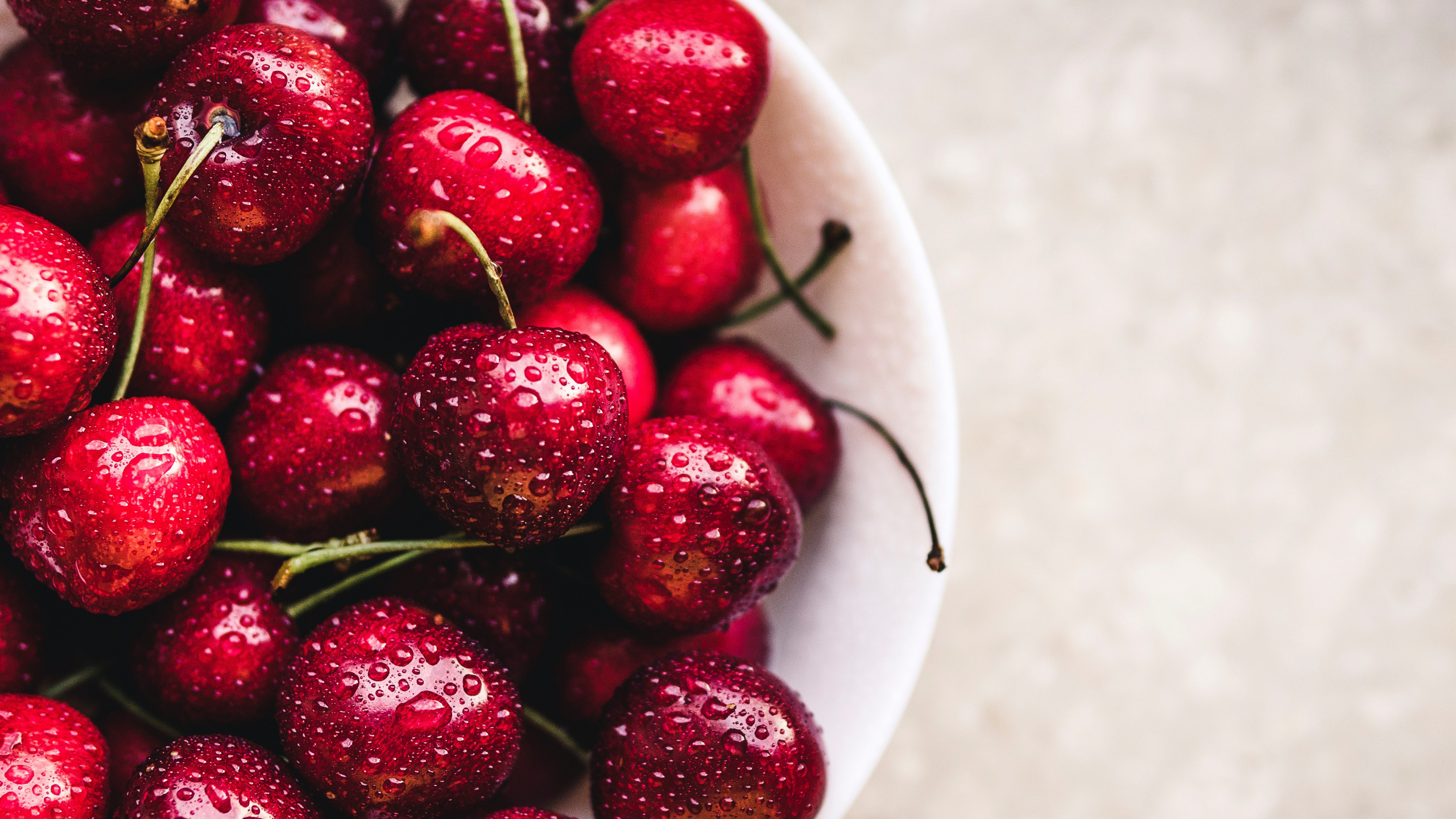 Red Cherries on White Ceramic Bowl. Wallpaper in 2560x1440 Resolution