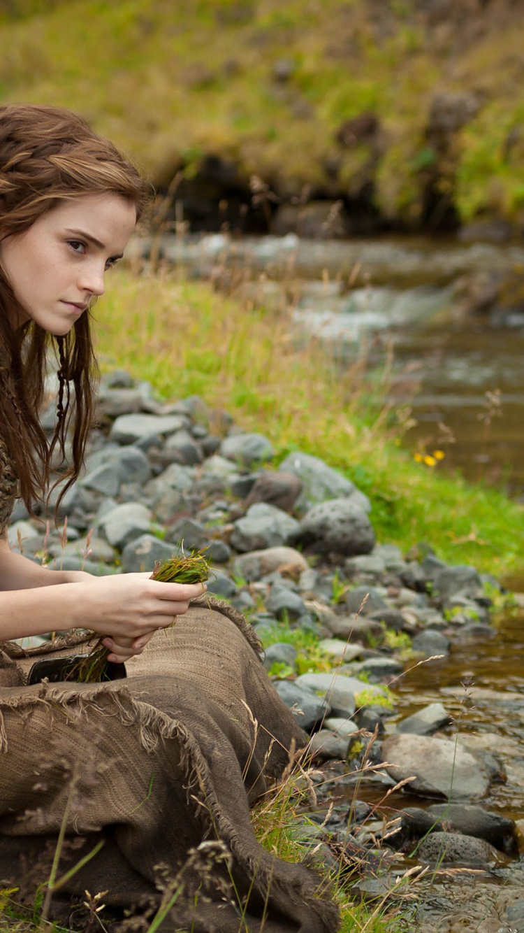 Woman in Brown and Black Leopard Print Tank Top Sitting on Rock Near River During Daytime. Wallpaper in 750x1334 Resolution