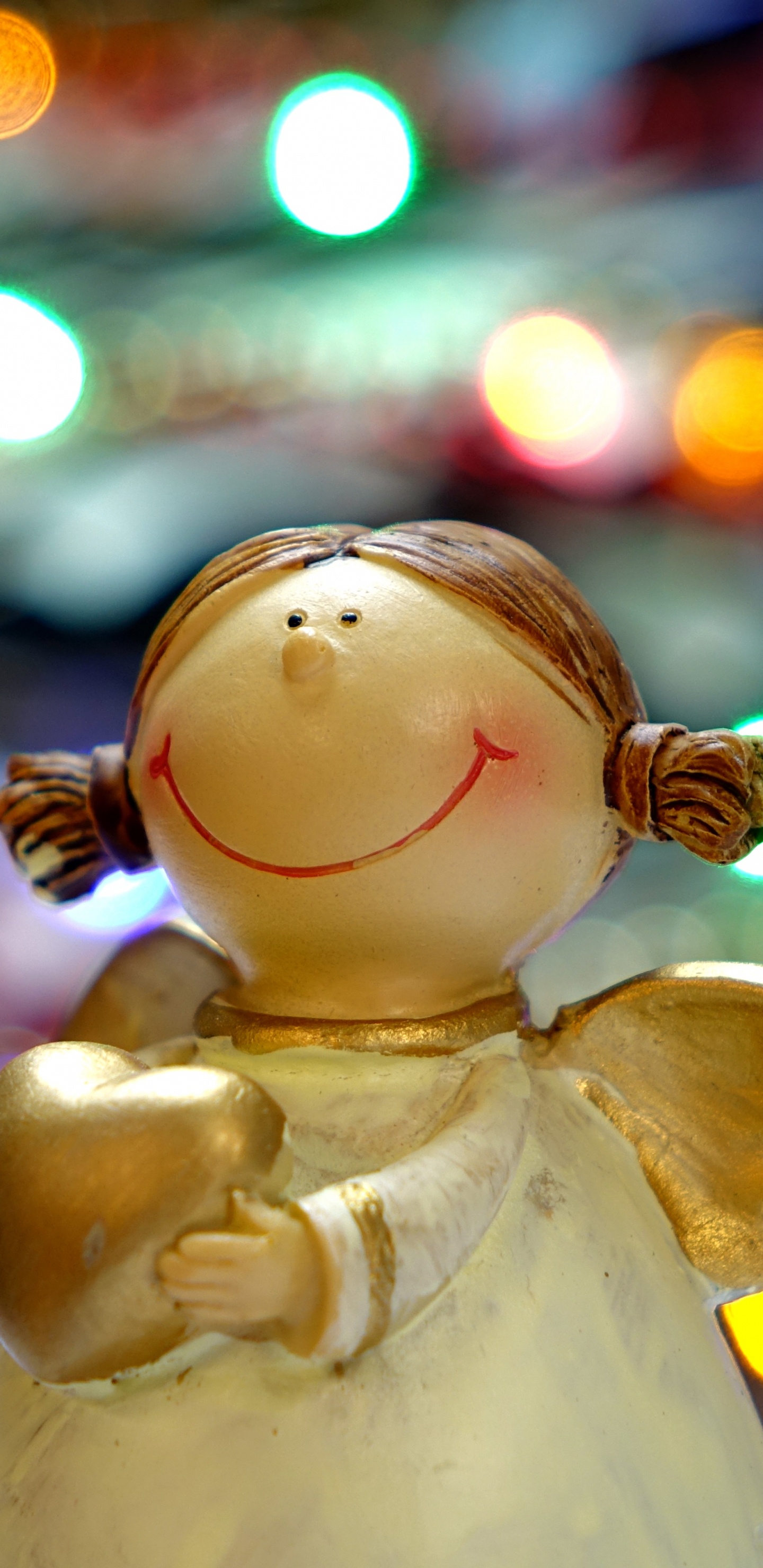 White Angel Ceramic Figurine in Bokeh Photography. Wallpaper in 1440x2960 Resolution