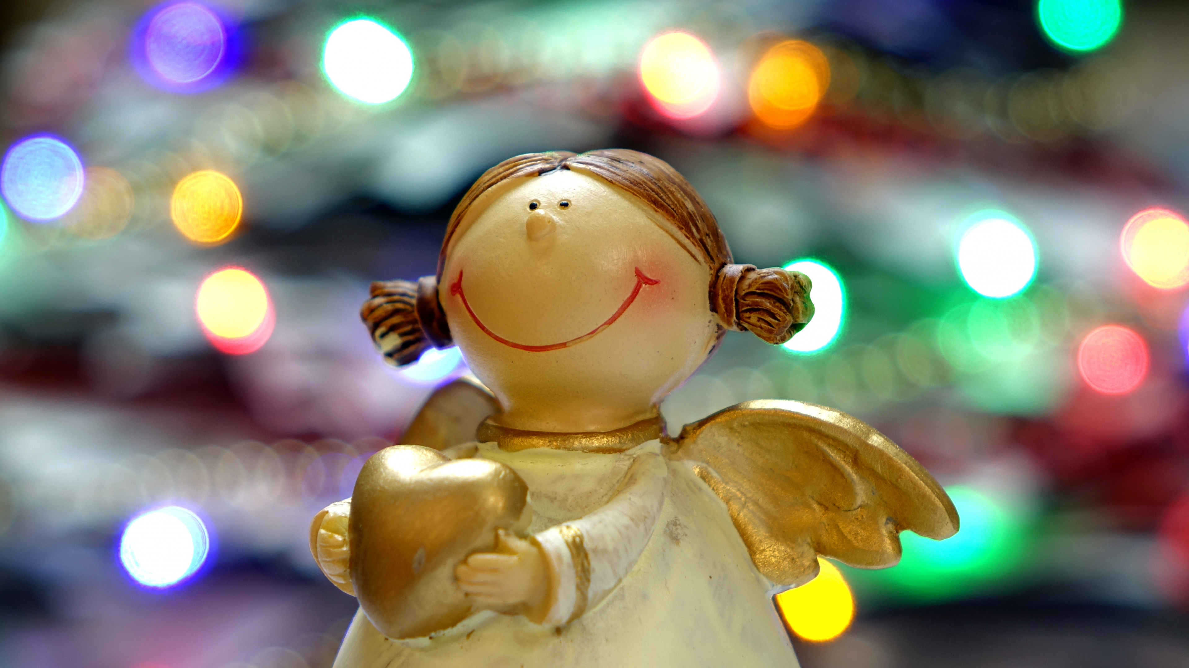 White Angel Ceramic Figurine in Bokeh Photography. Wallpaper in 3840x2160 Resolution