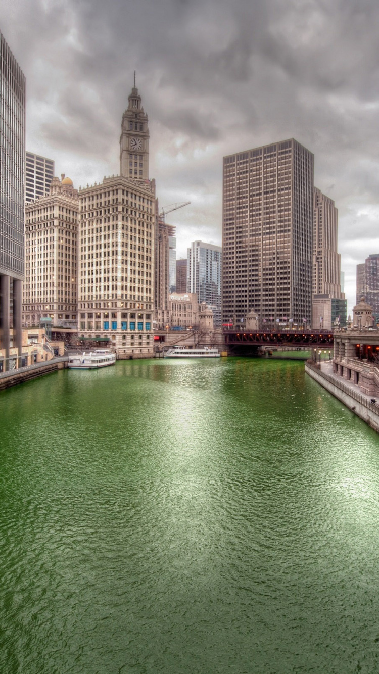 Body of Water Between High Rise Buildings During Daytime. Wallpaper in 750x1334 Resolution