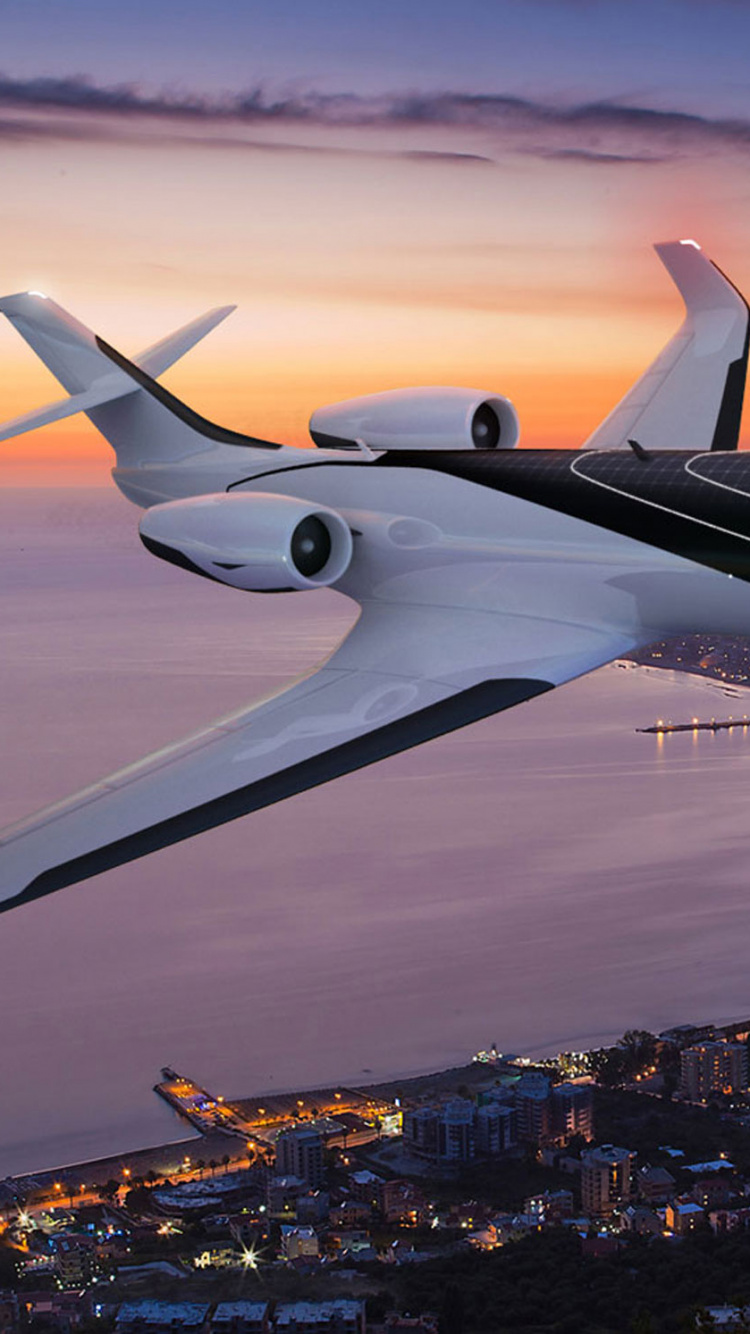 Avion Blanc Survolant la Ville Pendant la Nuit. Wallpaper in 750x1334 Resolution