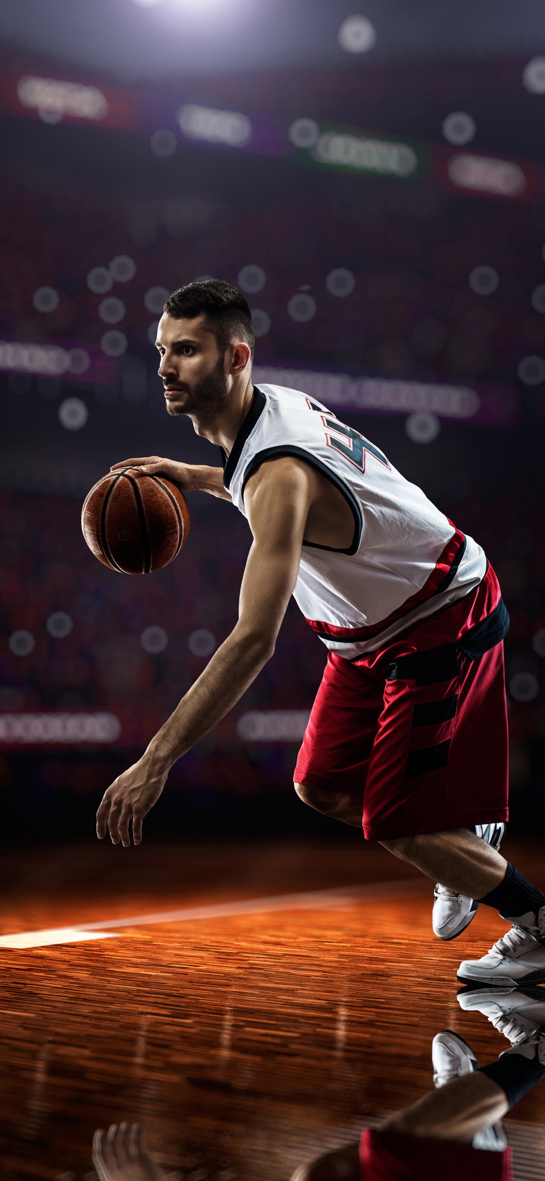 Basketball Player in Jersey Shirt and Shorts. Wallpaper in 1125x2436 Resolution