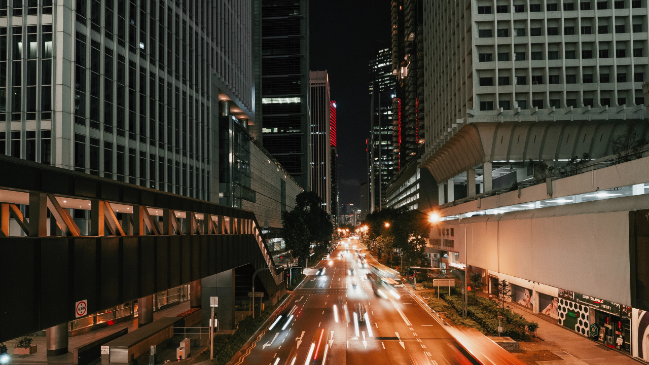 Cars on Road Between High Rise Buildings During Night Time. Wallpaper in 1280x720 Resolution