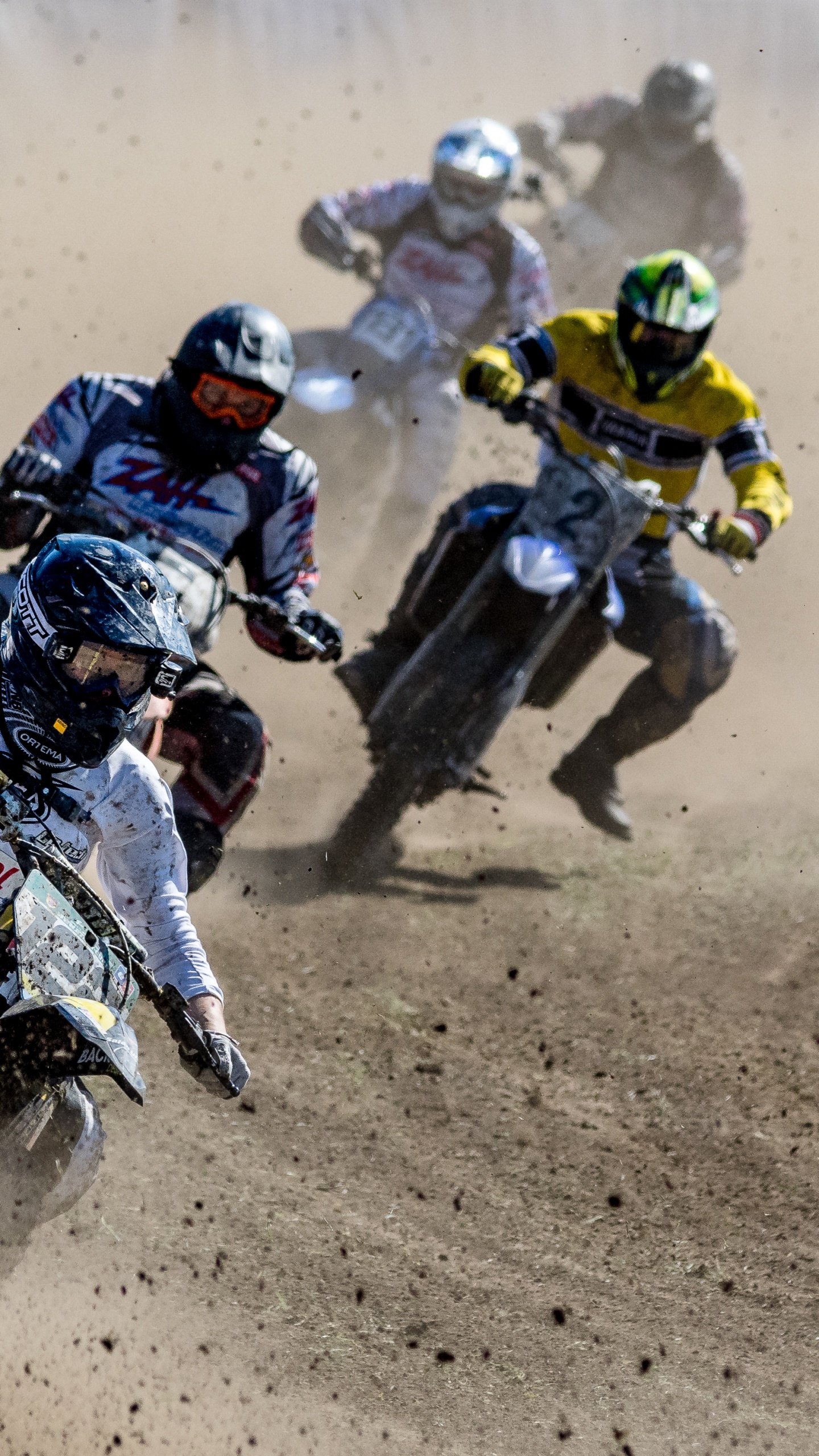Man in Black and Yellow Suit Riding Motocross Dirt Bike. Wallpaper in 1440x2560 Resolution