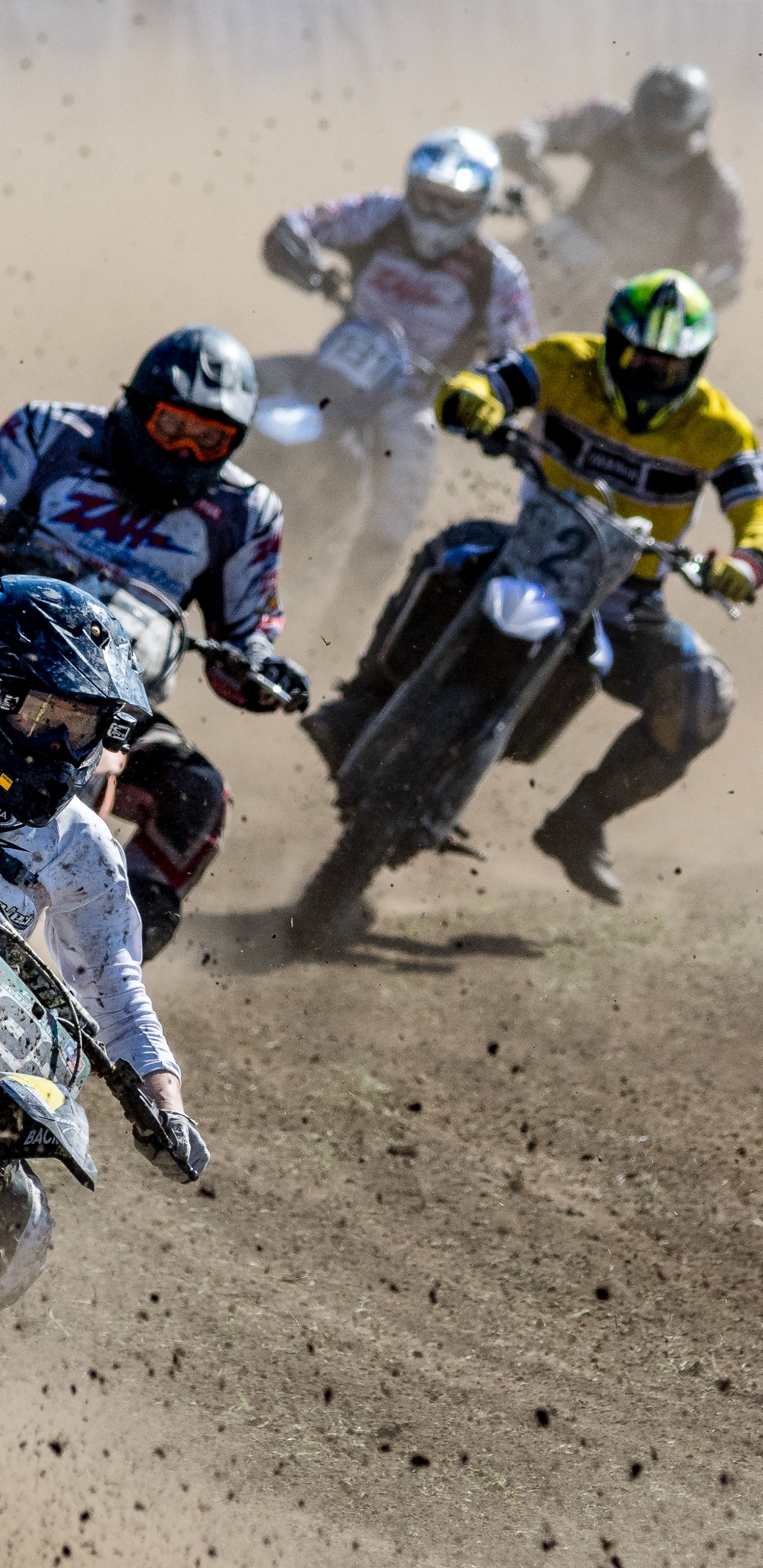 Man in Black and Yellow Suit Riding Motocross Dirt Bike. Wallpaper in 1440x2960 Resolution