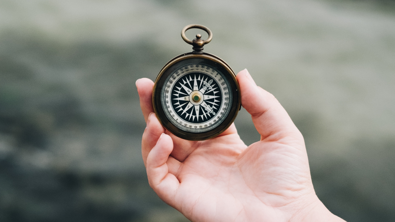 Person Holding Black and Silver Pocket Watch. Wallpaper in 1366x768 Resolution