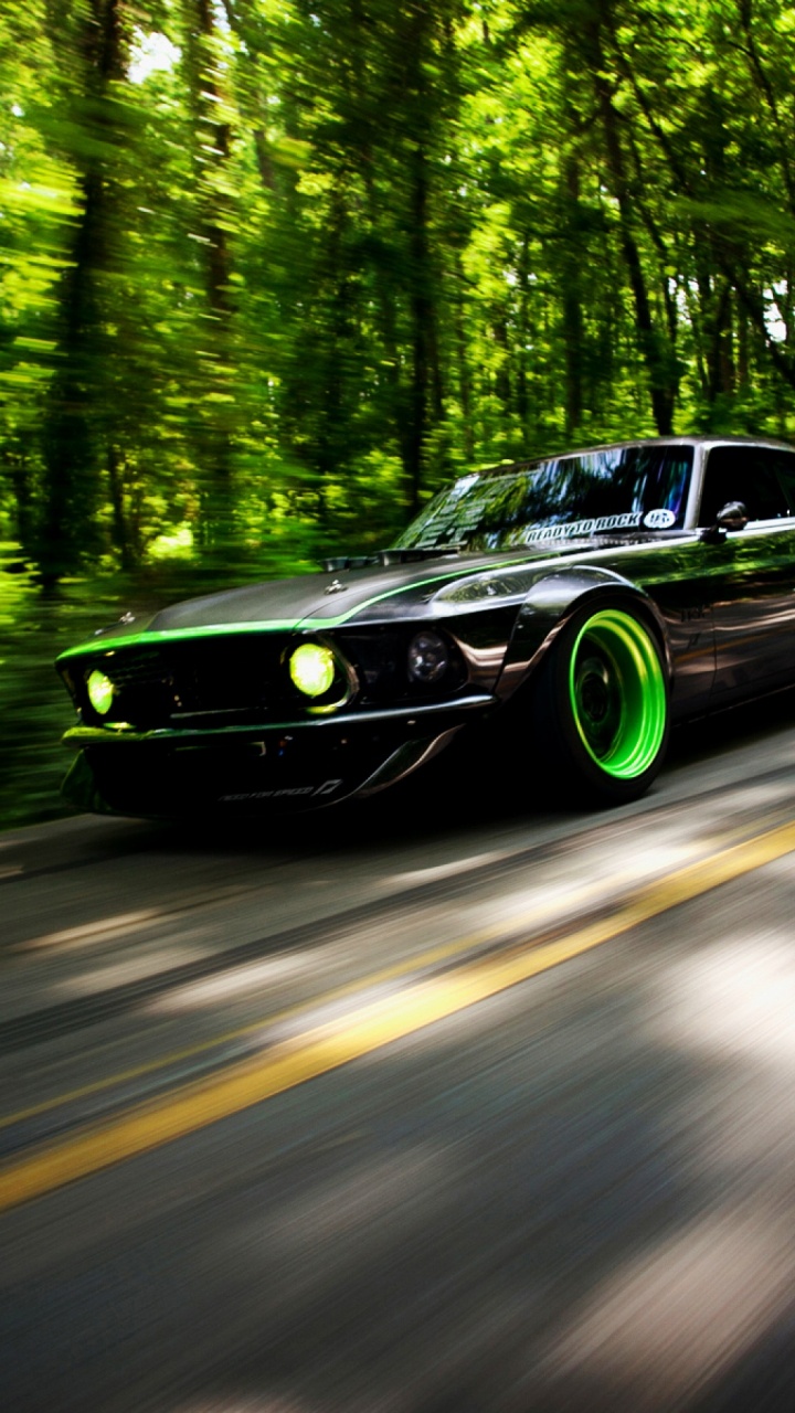 Black Coupe on Road in Between Green Trees During Daytime. Wallpaper in 720x1280 Resolution