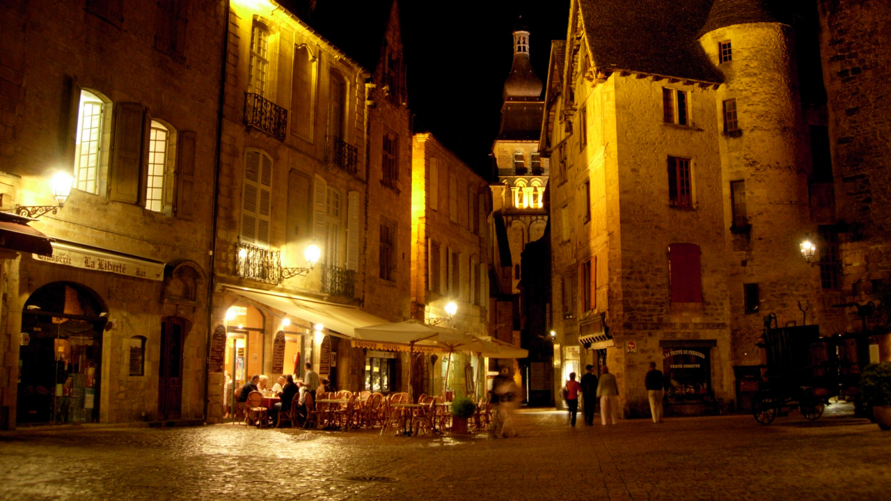 People Walking on Street Near Building During Night Time. Wallpaper in 1280x720 Resolution