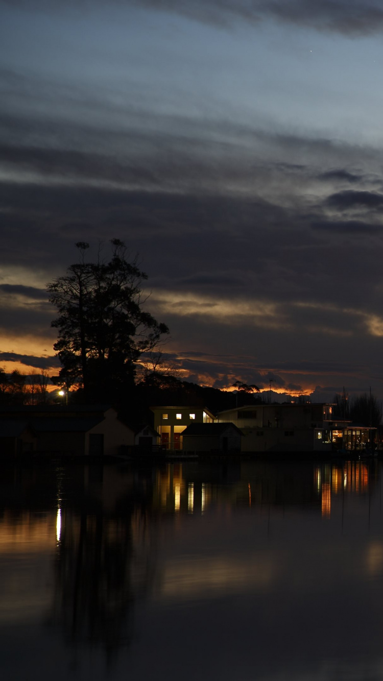 Body of Water Near City During Sunset. Wallpaper in 750x1334 Resolution