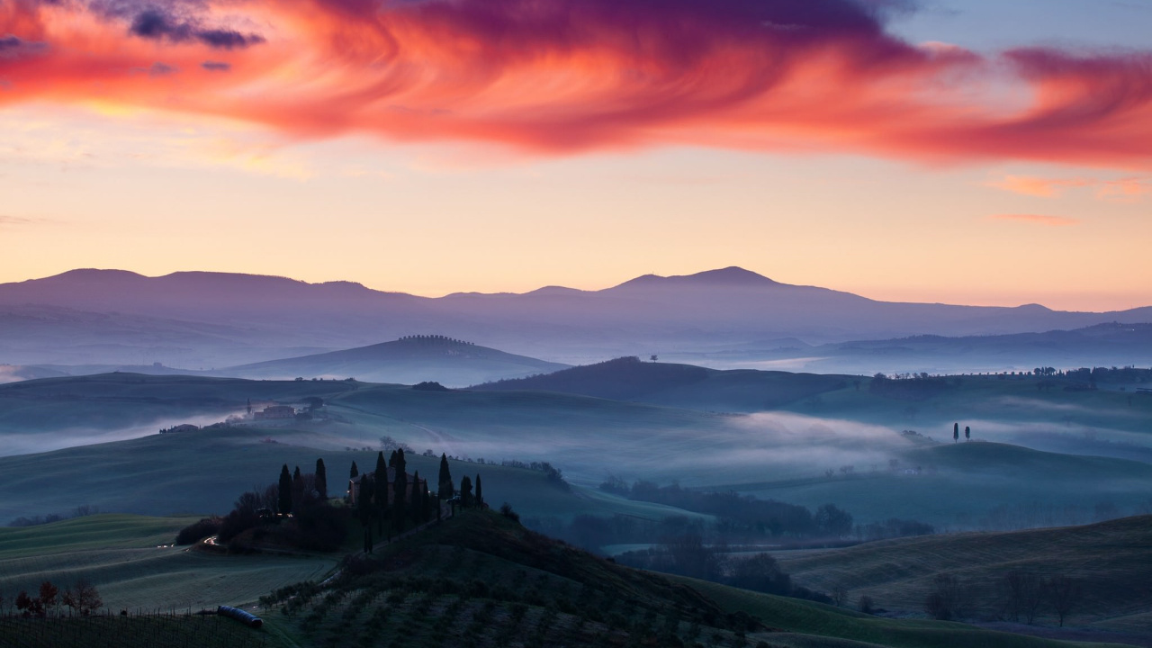 Green Mountains Under Orange Sky. Wallpaper in 1280x720 Resolution