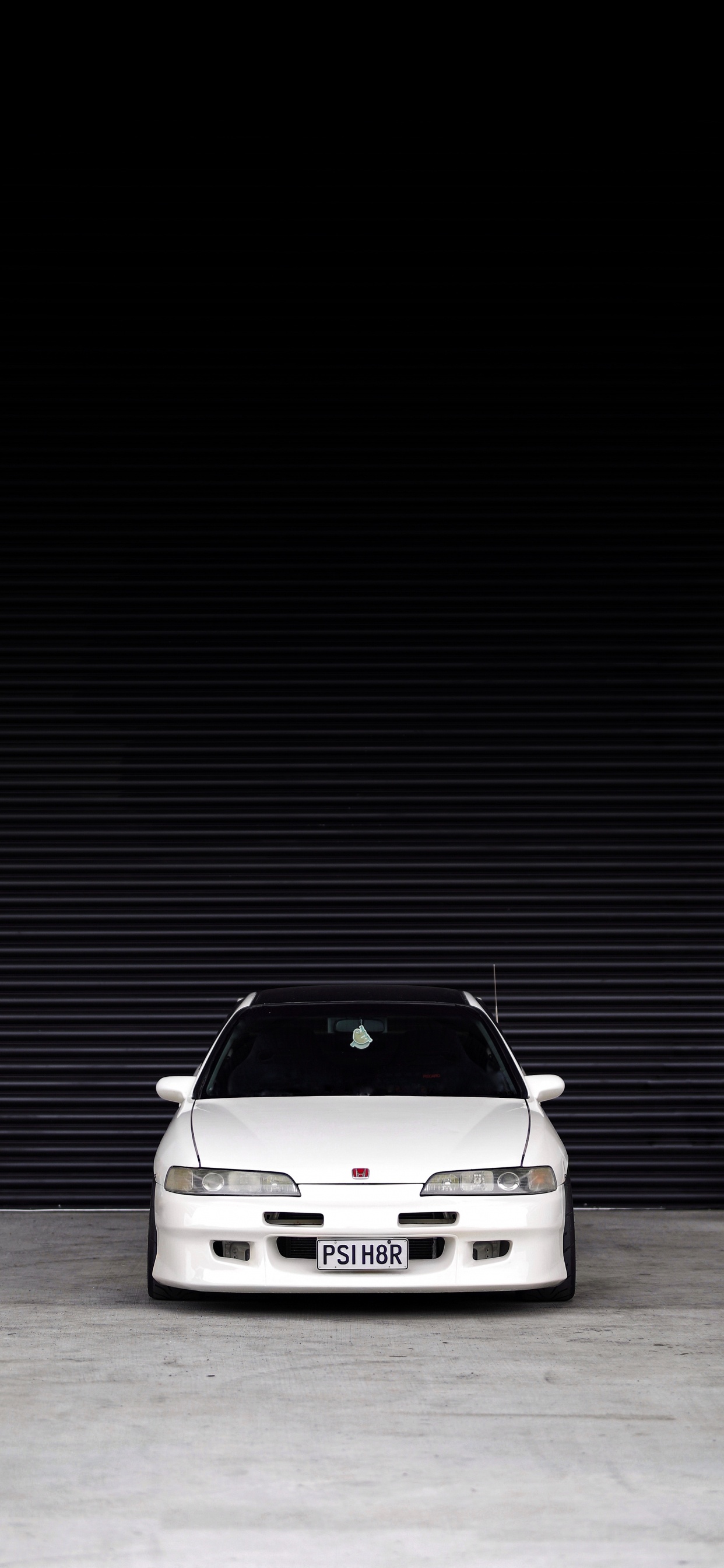 White Car in a White Room. Wallpaper in 1242x2688 Resolution