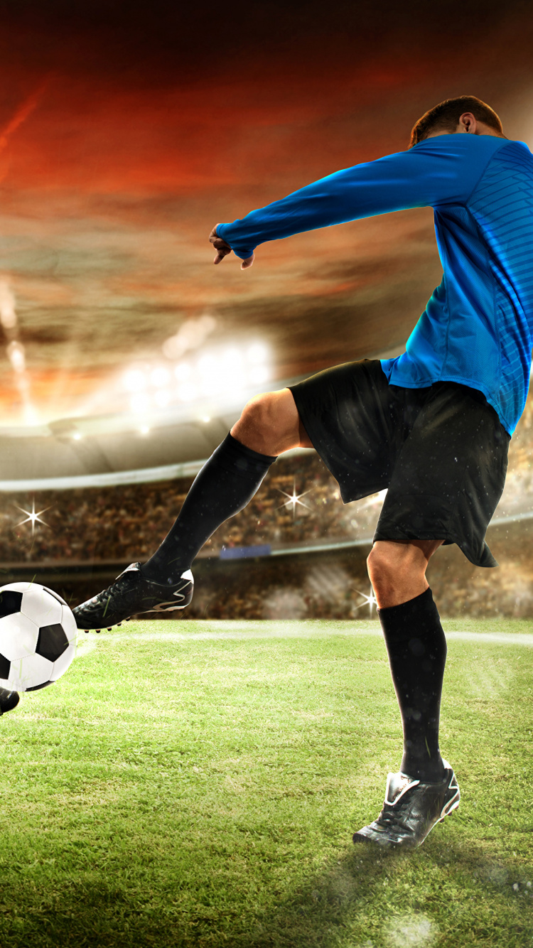 Garçon en Chemise Rouge Jouant au Football Sur Terrain D'herbe Verte. Wallpaper in 750x1334 Resolution