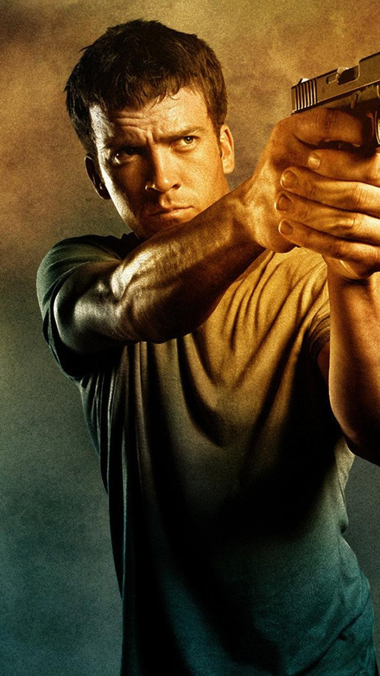 Man in Gray Crew Neck T-shirt Holding Black Semi Automatic Pistol. Wallpaper in 750x1334 Resolution