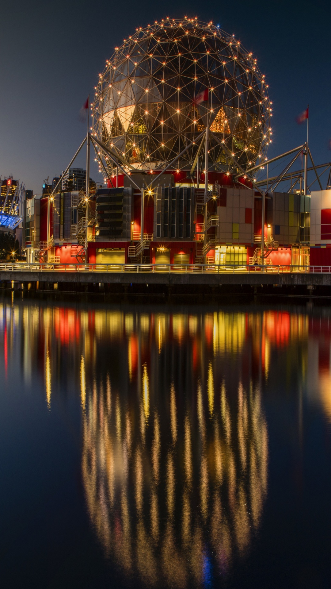 City Skyline Across Body of Water During Night Time. Wallpaper in 1080x1920 Resolution