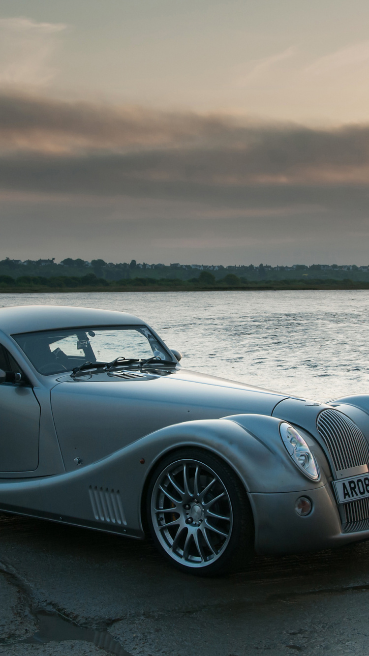 Black Porsche 911 on Shore During Daytime. Wallpaper in 750x1334 Resolution