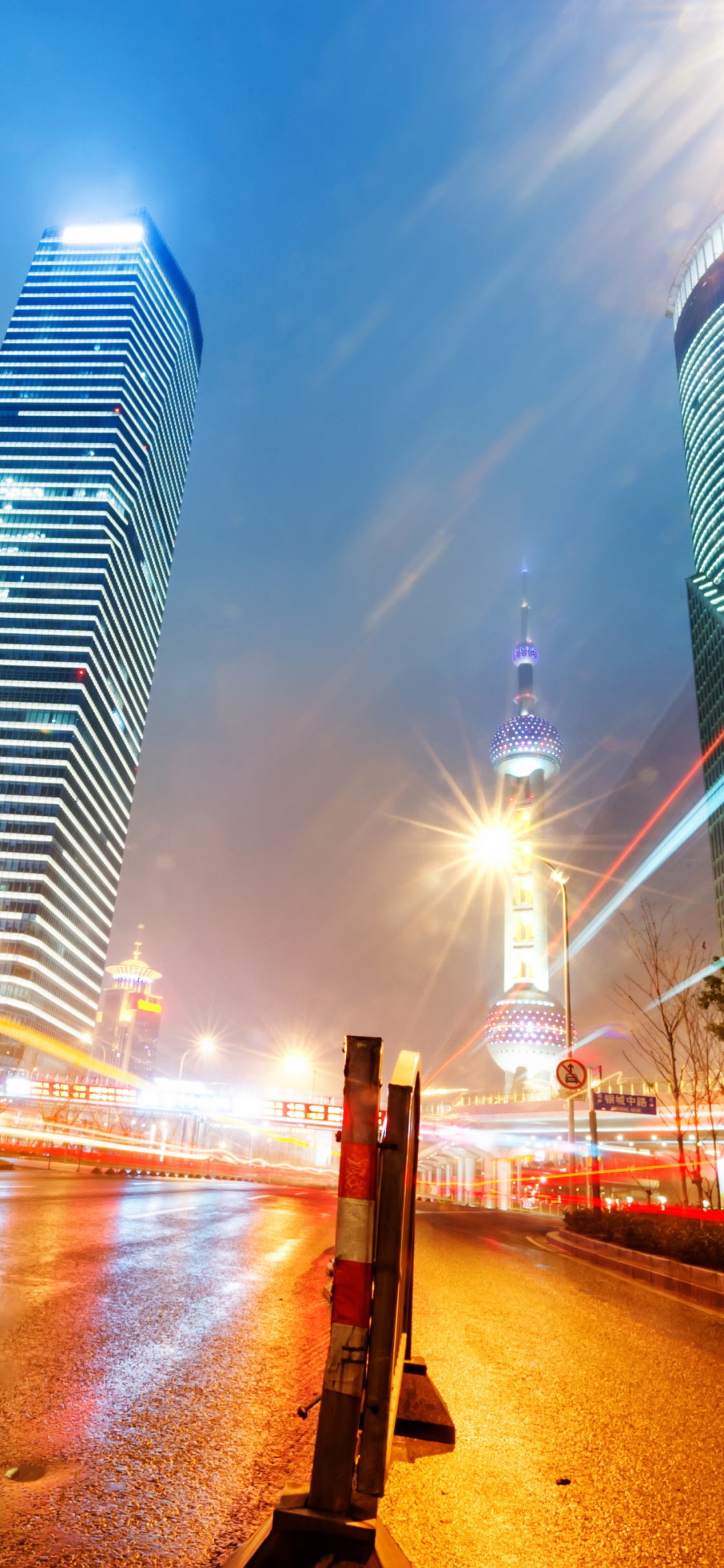 City Buildings During Night Time. Wallpaper in 1125x2436 Resolution