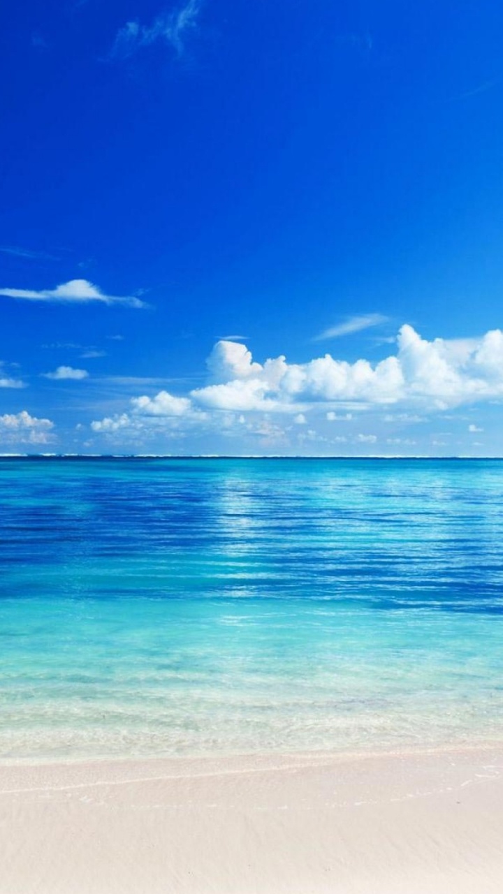 Blaues Meer Unter Blauem Himmel Tagsüber. Wallpaper in 720x1280 Resolution