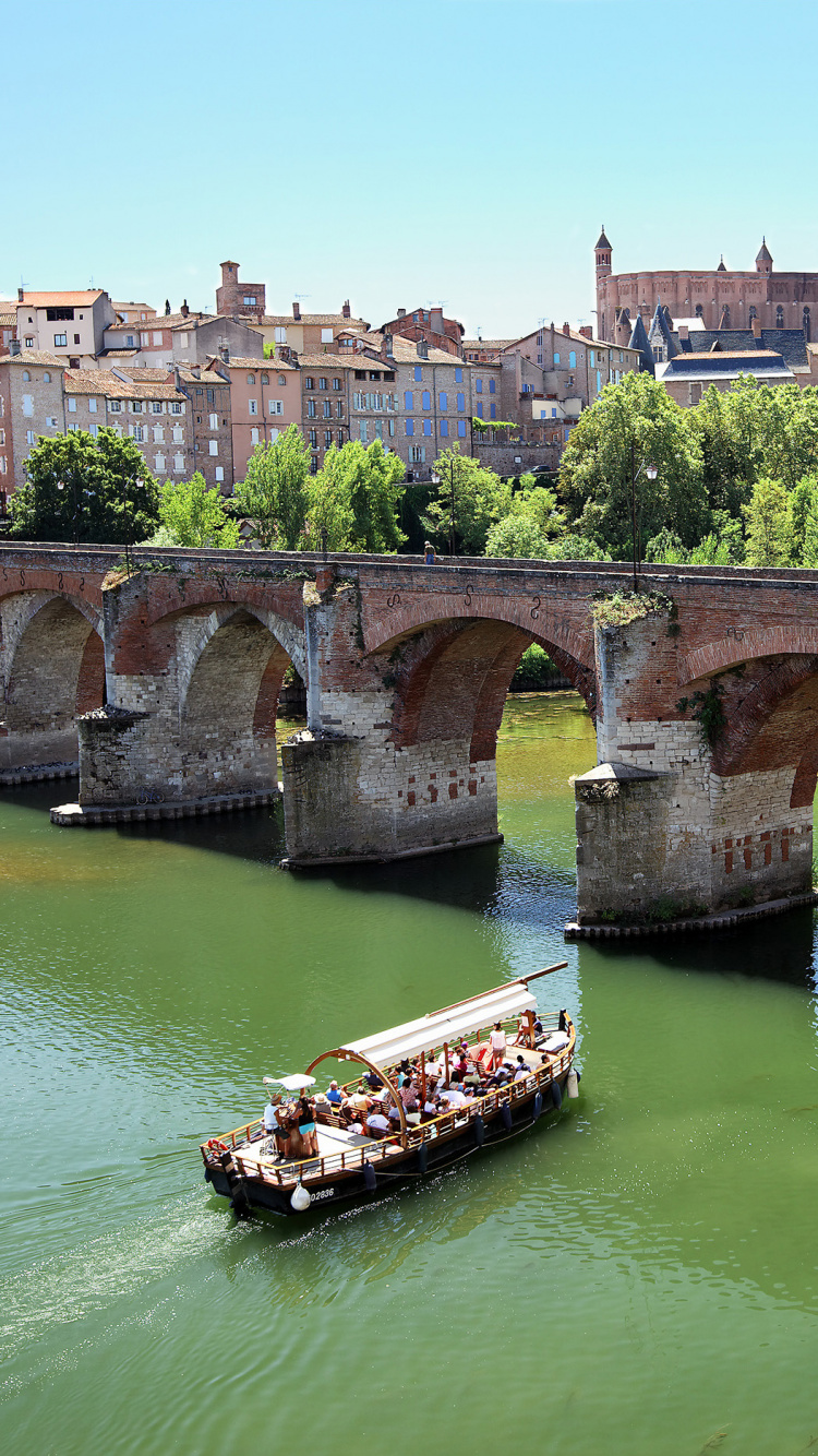 Brown Concrete Bridge Over River During Daytime. Wallpaper in 750x1334 Resolution