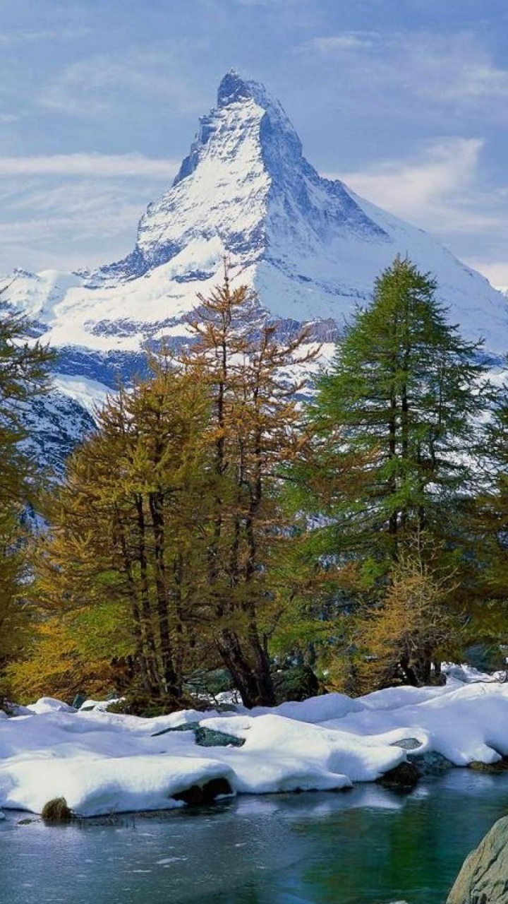 Green Trees Near Snow Covered Mountain During Daytime. Wallpaper in 720x1280 Resolution