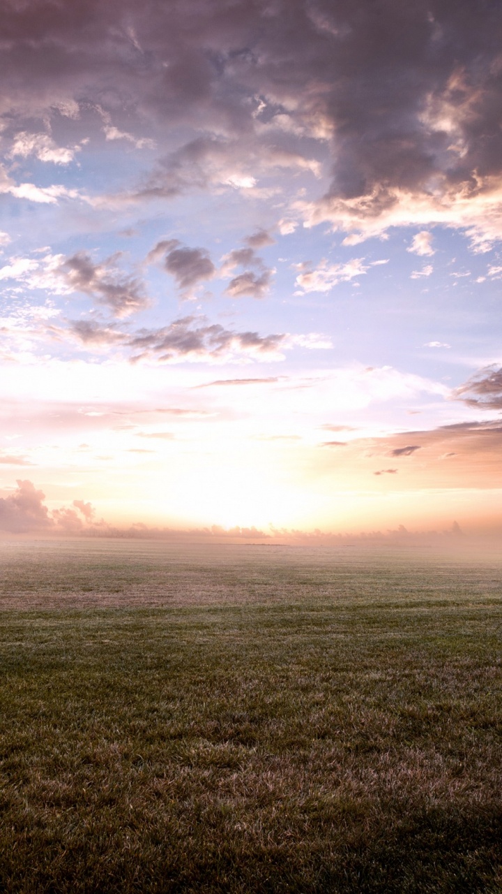 Green Grass Field Under Cloudy Sky During Daytime. Wallpaper in 720x1280 Resolution