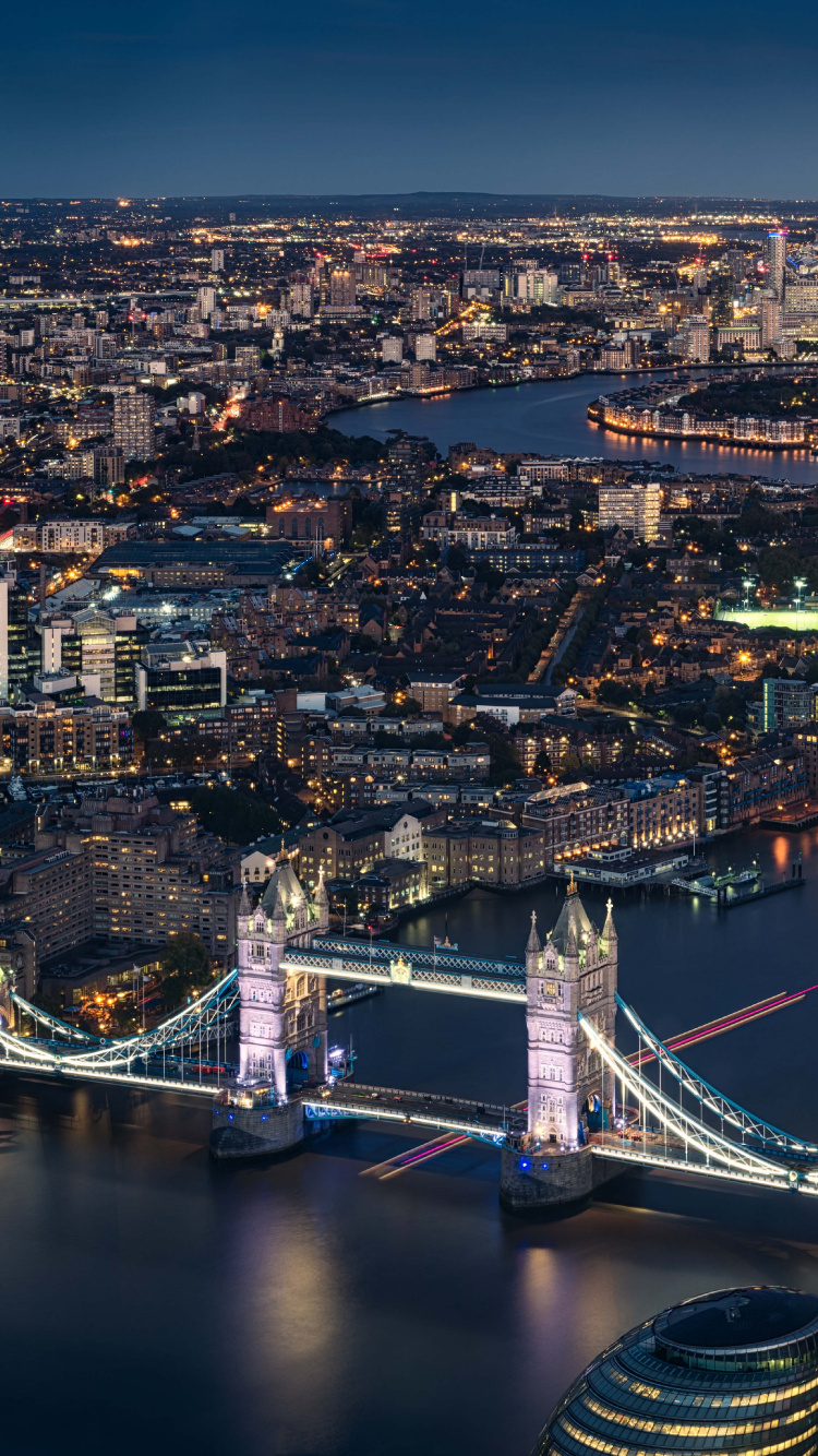 Aerial View of City Buildings During Night Time. Wallpaper in 750x1334 Resolution