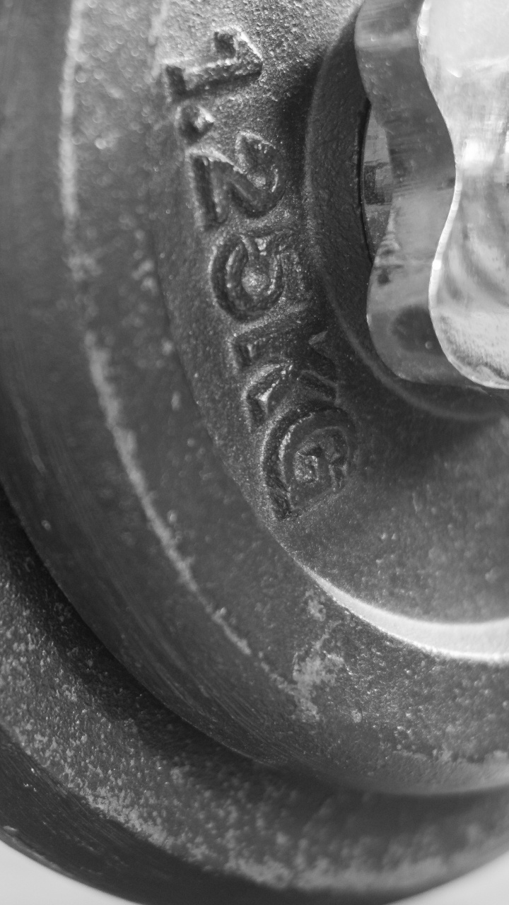 Black Dumbbell on White Textile. Wallpaper in 720x1280 Resolution