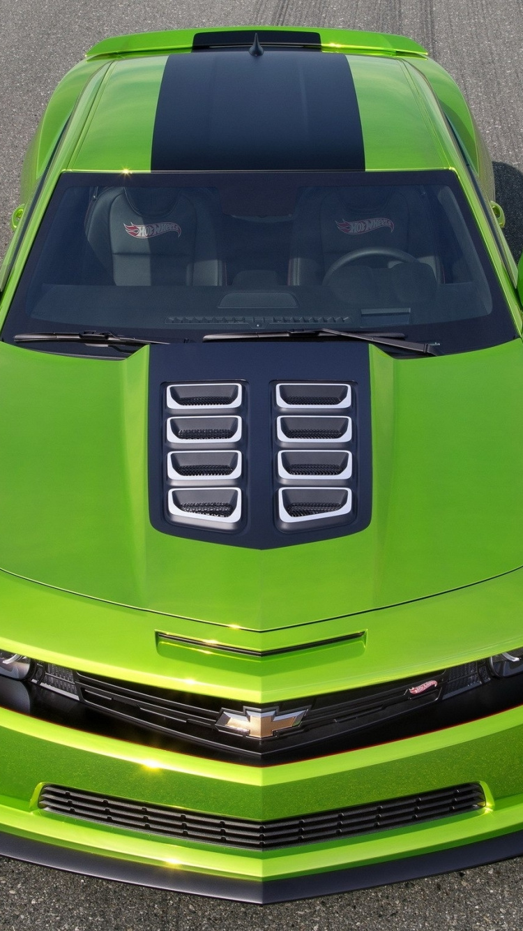 Green Chevrolet Camaro on Road. Wallpaper in 750x1334 Resolution