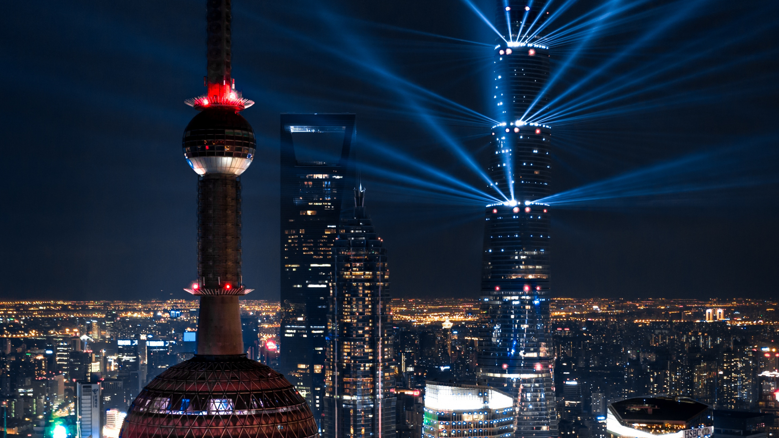 City Buildings During Night Time. Wallpaper in 2560x1440 Resolution