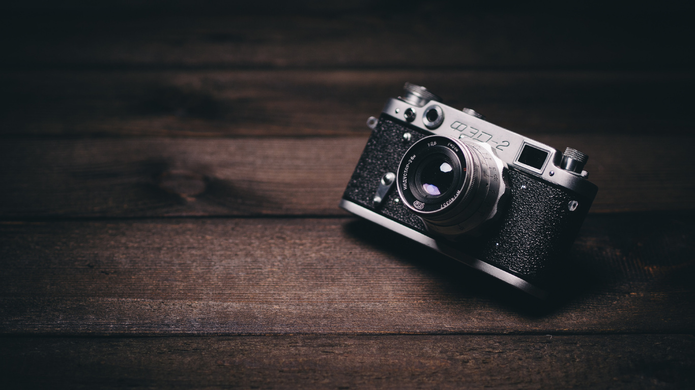 Black and Silver Camera on Brown Wooden Table. Wallpaper in 1366x768 Resolution