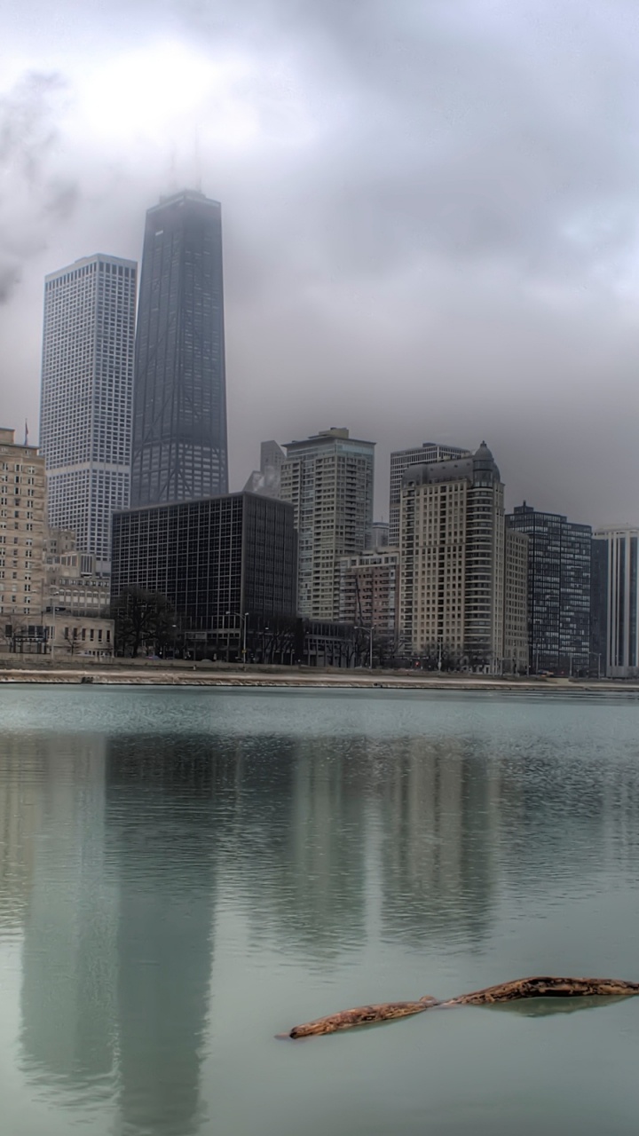 High Rise Buildings Near Body of Water During Daytime. Wallpaper in 720x1280 Resolution