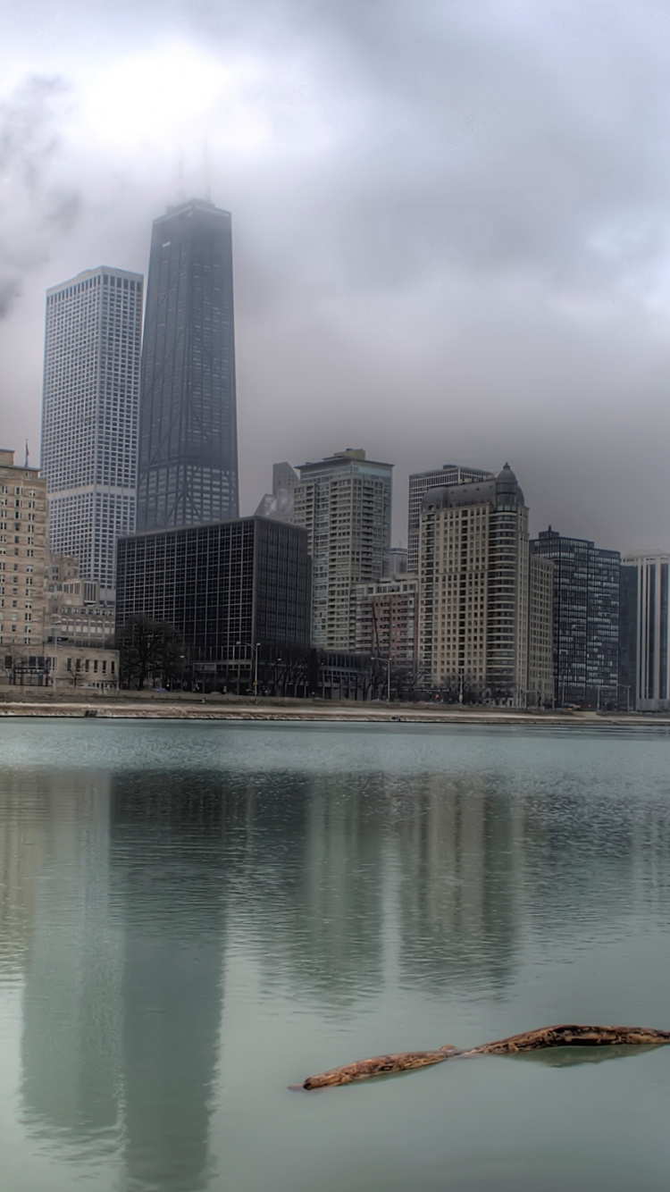 High Rise Buildings Near Body of Water During Daytime. Wallpaper in 750x1334 Resolution