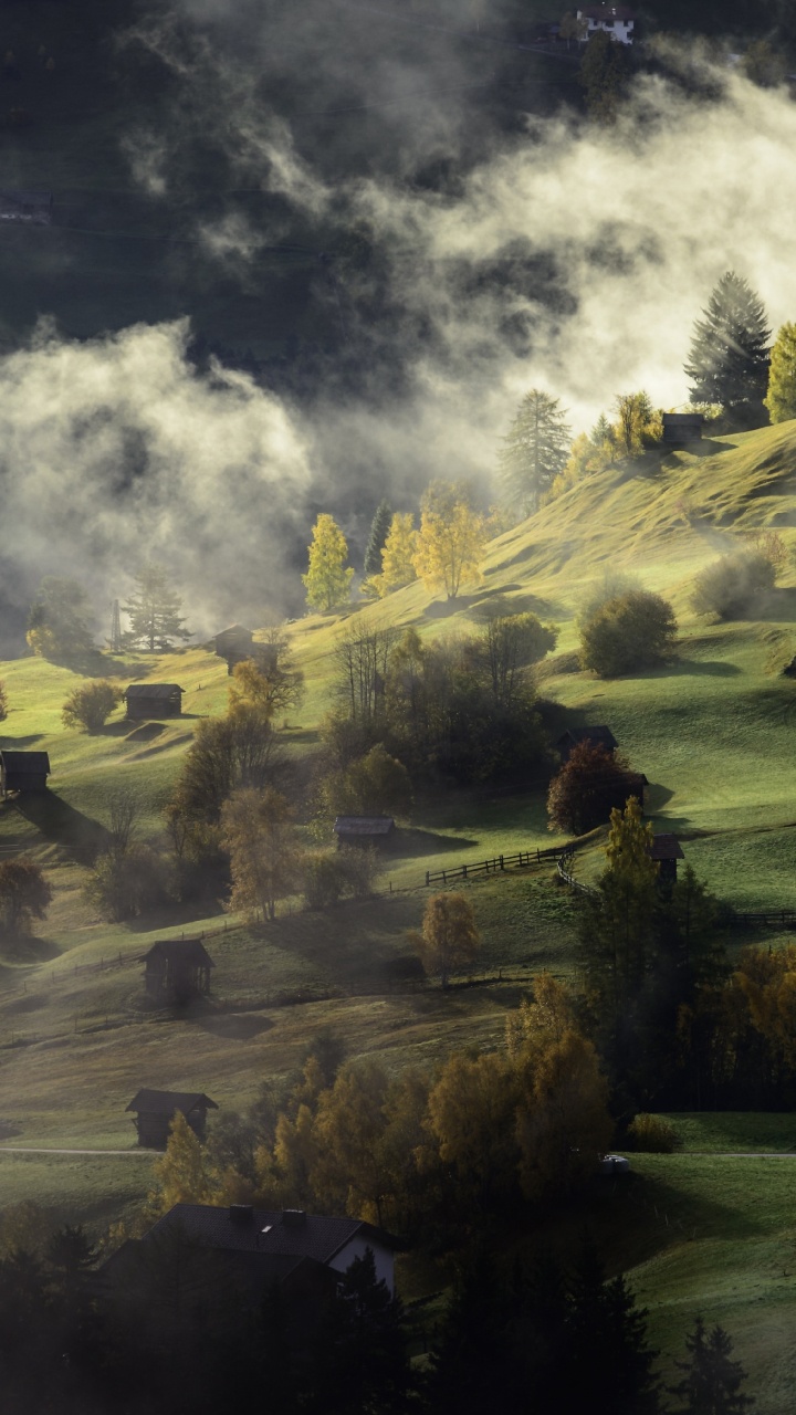 Green Grass Field Near Lake Under Cloudy Sky During Daytime. Wallpaper in 720x1280 Resolution