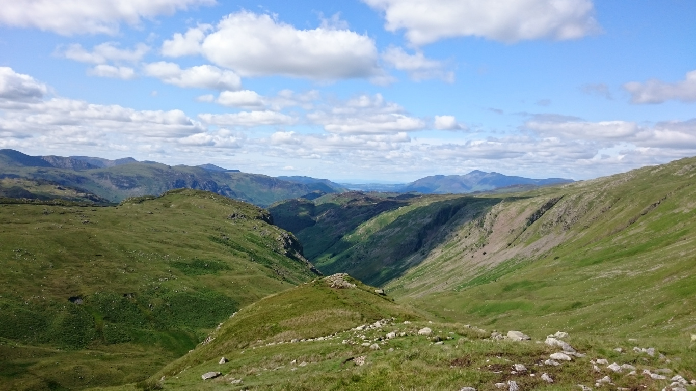 Green and Brown Mountains Under White Clouds and Blue Sky During Daytime. Wallpaper in 1366x768 Resolution