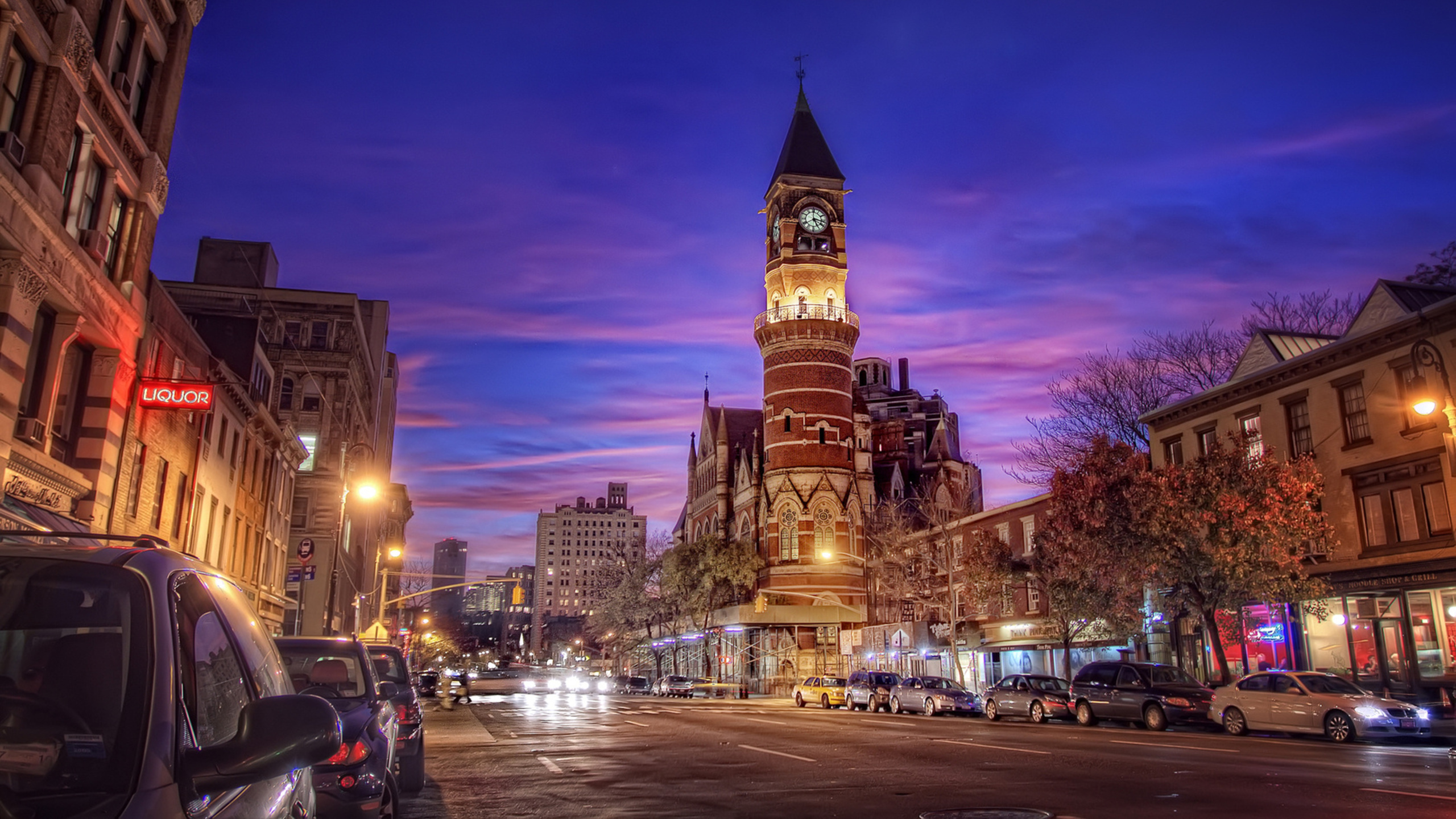 Brown Concrete Building During Night Time. Wallpaper in 2560x1440 Resolution