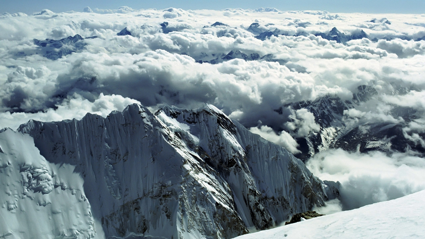 Snow Covered Mountain Under White Clouds During Daytime. Wallpaper in 1366x768 Resolution