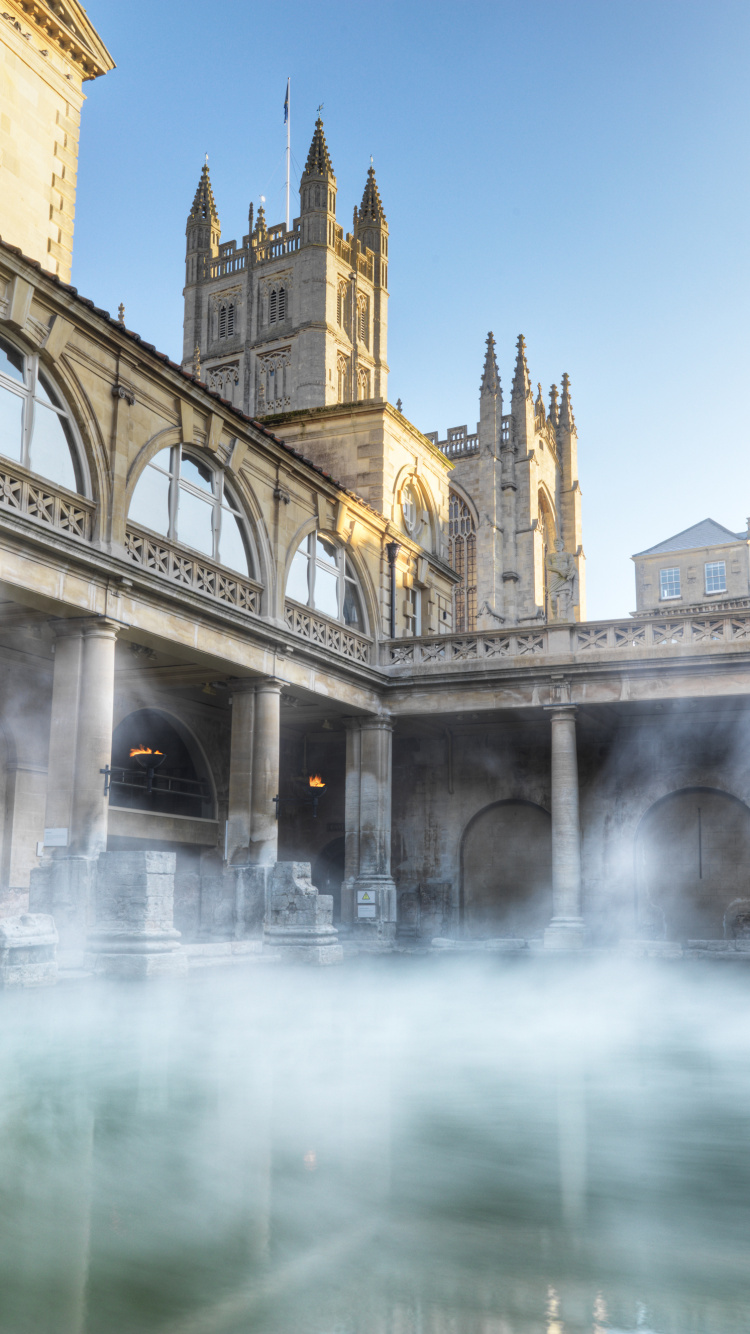 Bâtiment en Béton Beige Près de la Fontaine D'eau. Wallpaper in 750x1334 Resolution