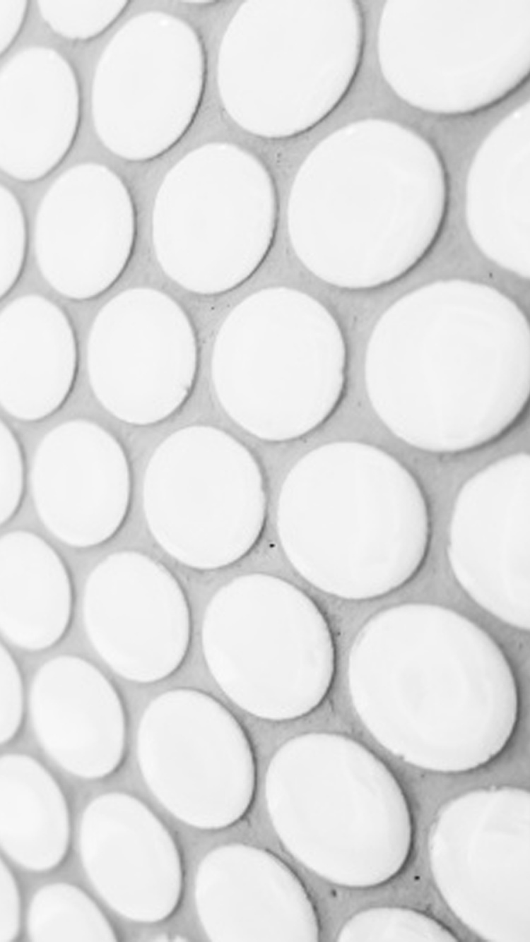 White and Black Polka Dot Textile. Wallpaper in 750x1334 Resolution