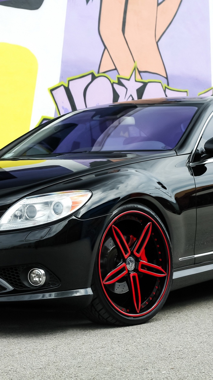 Black Mercedes Benz Coupe Parked Beside Yellow and White Painted Wall. Wallpaper in 720x1280 Resolution