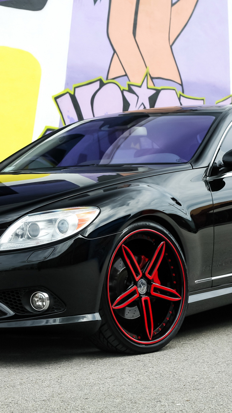 Black Mercedes Benz Coupe Parked Beside Yellow and White Painted Wall. Wallpaper in 750x1334 Resolution