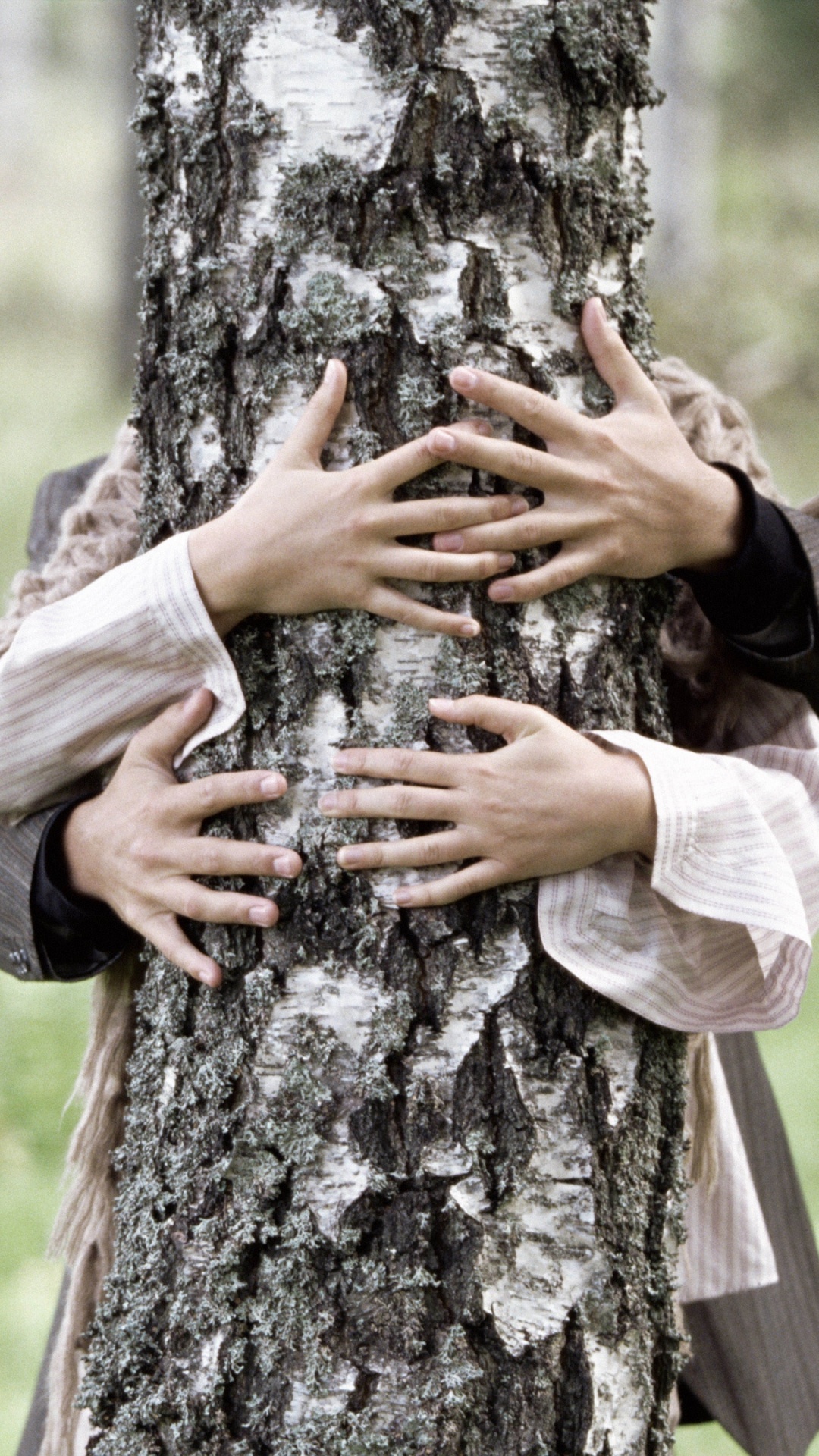 Person in Brown Jacket Leaning on Brown Tree Trunk. Wallpaper in 1080x1920 Resolution