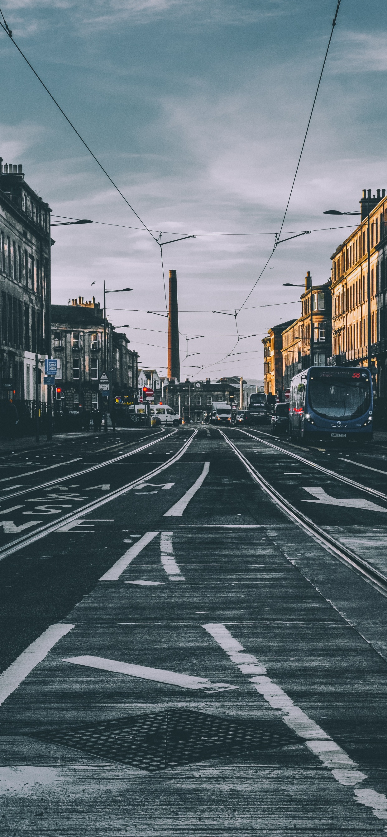 Cars on Road Between Buildings During Daytime. Wallpaper in 1242x2688 Resolution