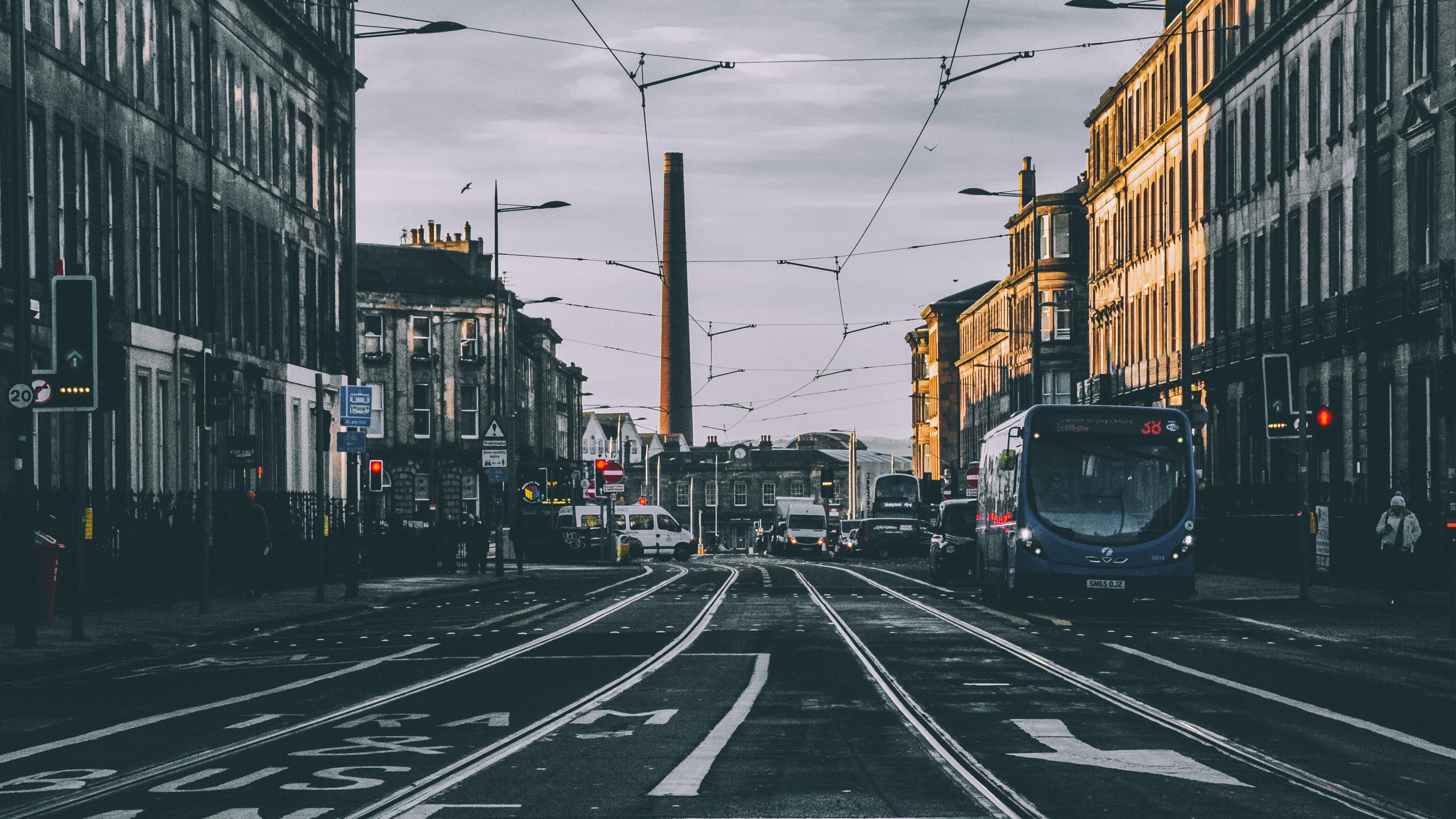 Cars on Road Between Buildings During Daytime. Wallpaper in 2560x1440 Resolution
